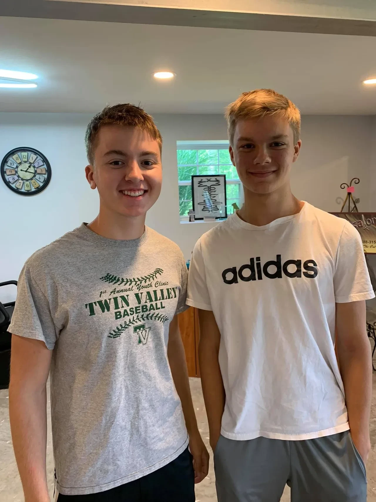 Two young guys after their haircuts at Marisalon